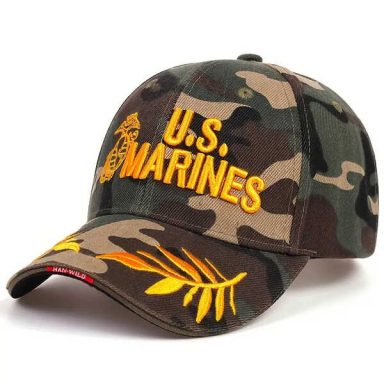 Camouflage cap with "U.S. MARINES" embroidered in yellow.